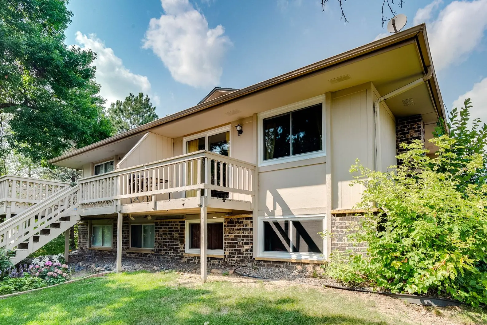 Rear exterior of home with new replacement windows and doors