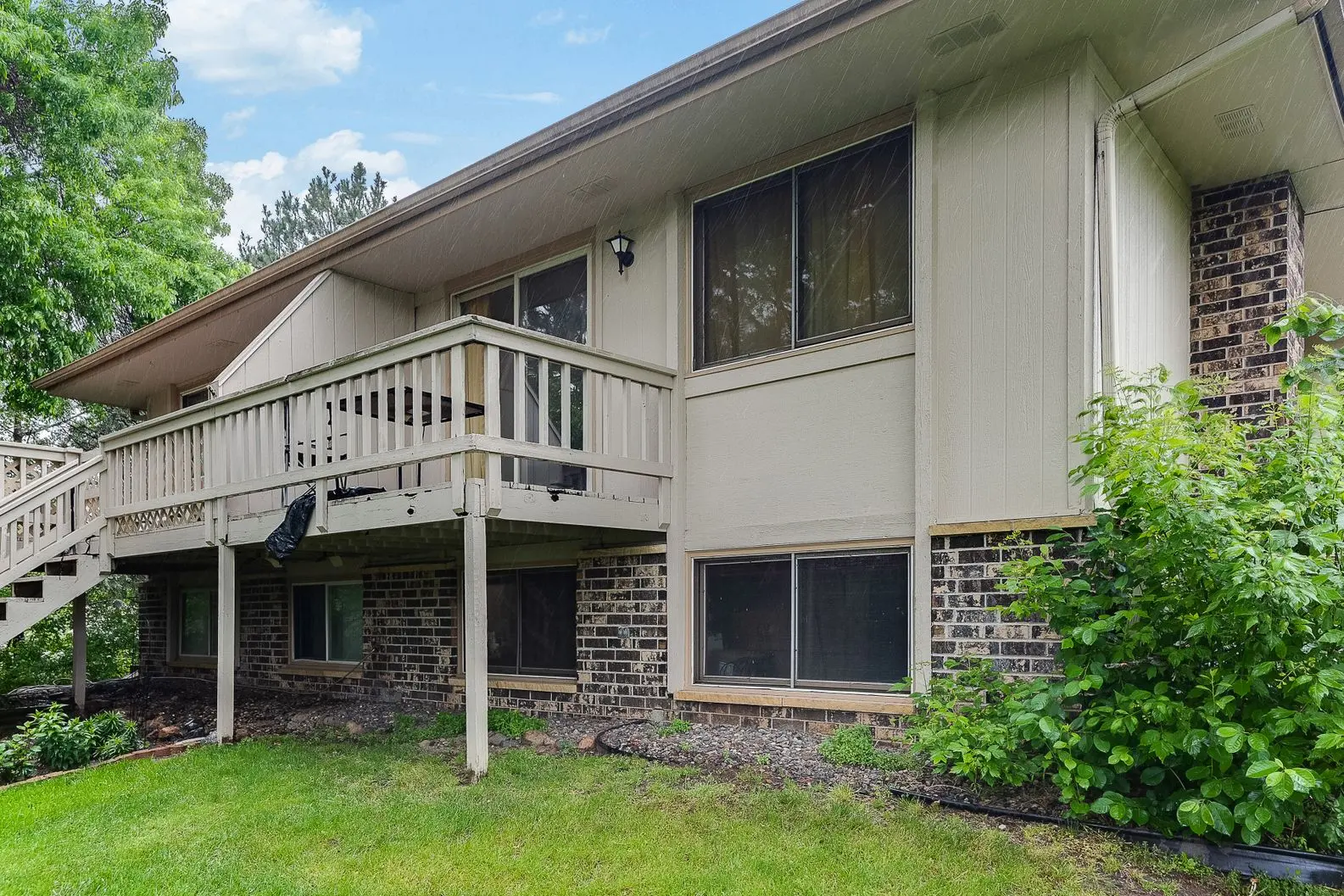 Before photo of Home remodel with new siding, windows, and deck installation