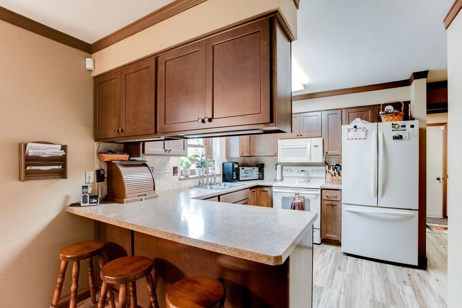 Kitchen remodel with new white cabinets and energy-efficient windows