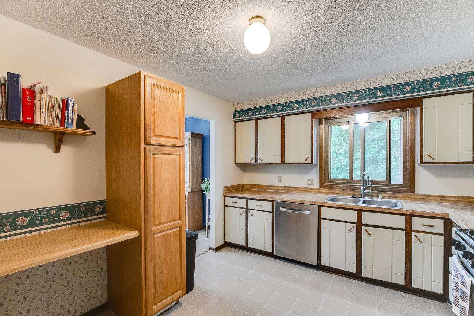 White and wood kitchen with upgraded window installation