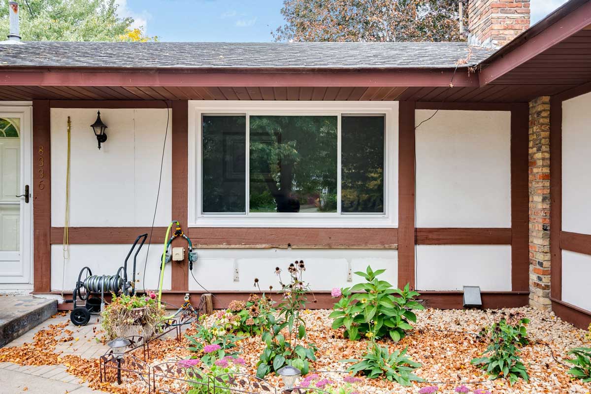 Updated home exterior with new vinyl replacement windows