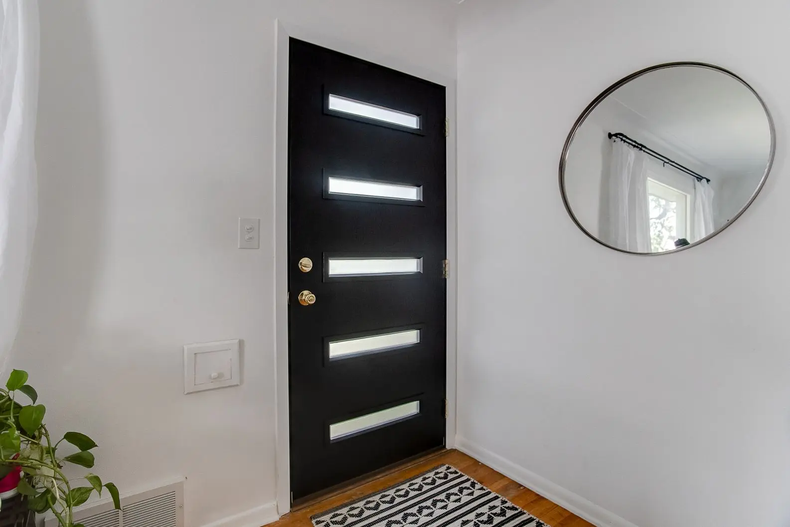Modern black interior door with horizontal glass inserts