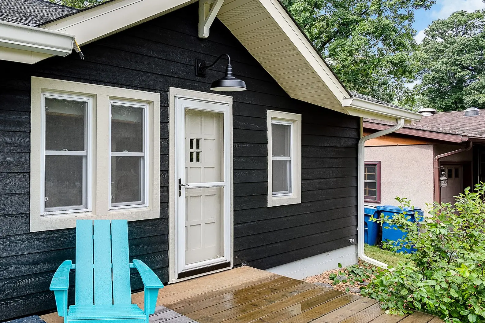 Updated exterior featuring blue siding and white-framed windows