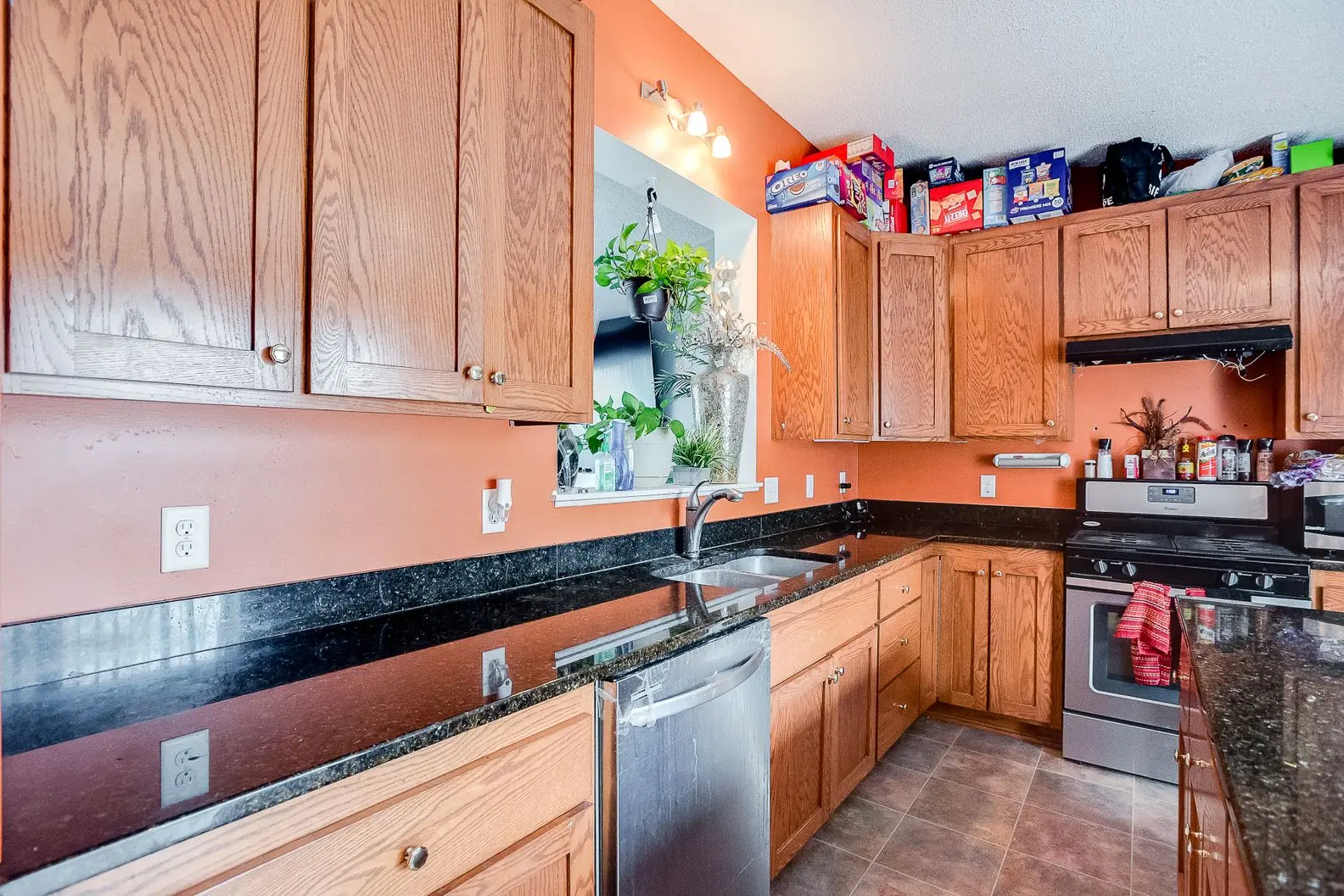 Updated kitchen with new wood cabinetry, oven, and flooring