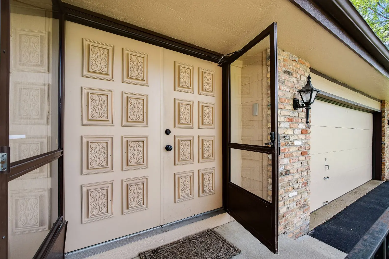 Decorative front door with geometric panel design and black hardware