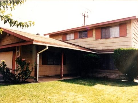Residential duplex with new siding, windows, and exterior door installation