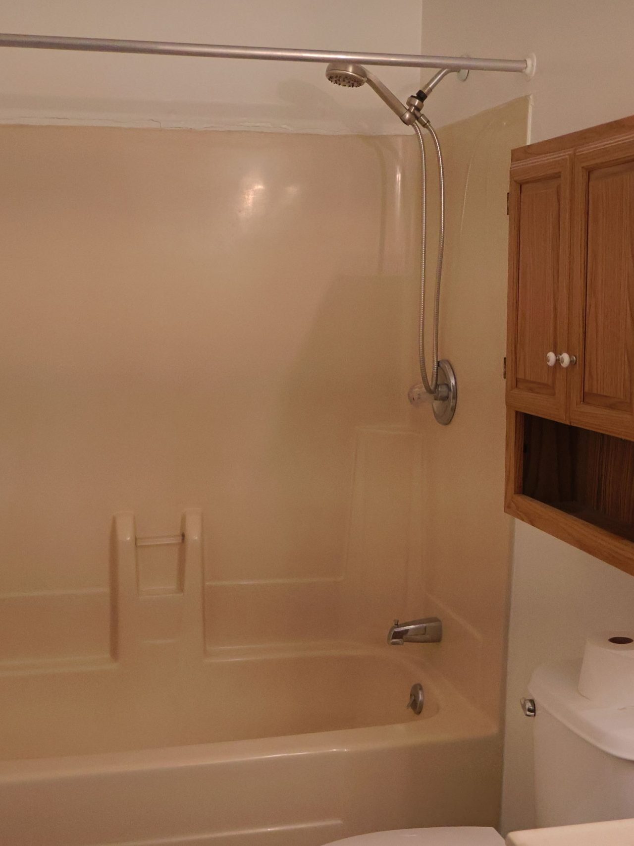 Before photo of acrylic tub and shower combo installation