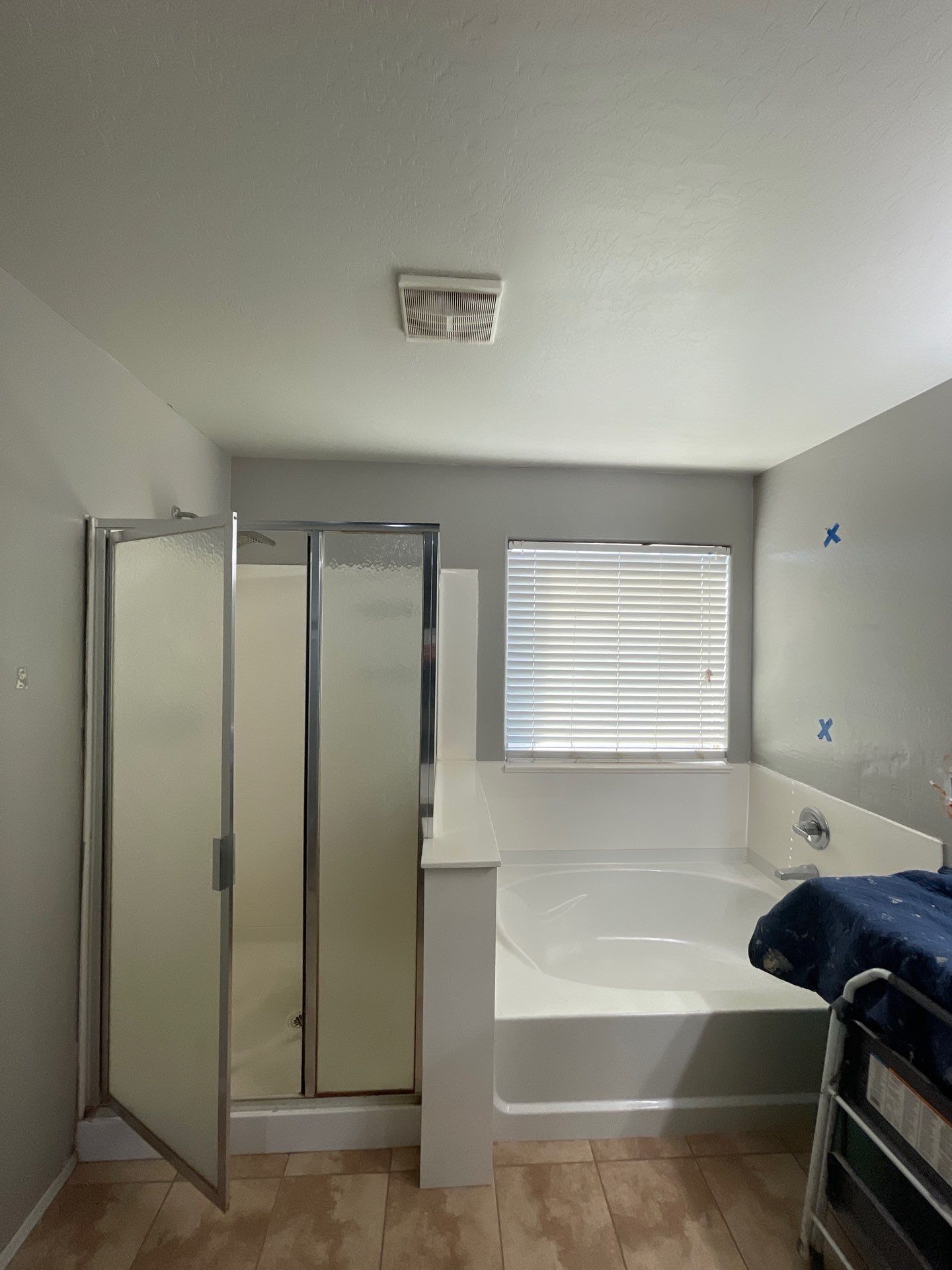 Newly installed bathtub and shower combo with tile surround