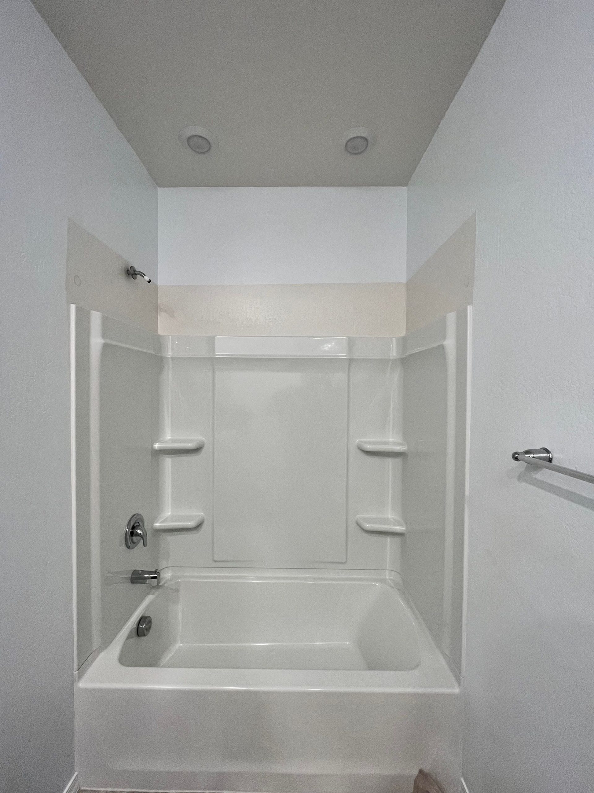 New acrylic tub and shower combo installation