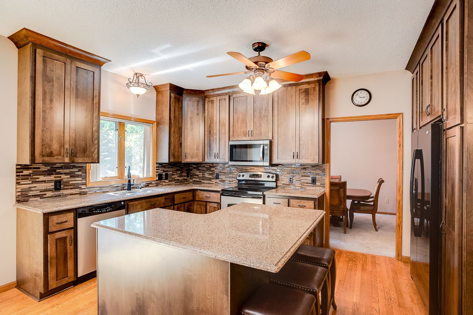 17515-Kodiak-Ave-After-001 Kitchen remodel with oak cabinets and upgraded stainless appliances