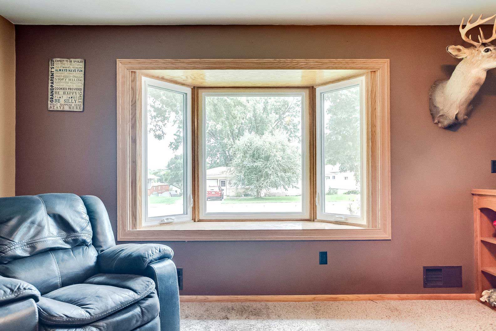20240627_windows19 Living room remodel with brown trim and large new windows
