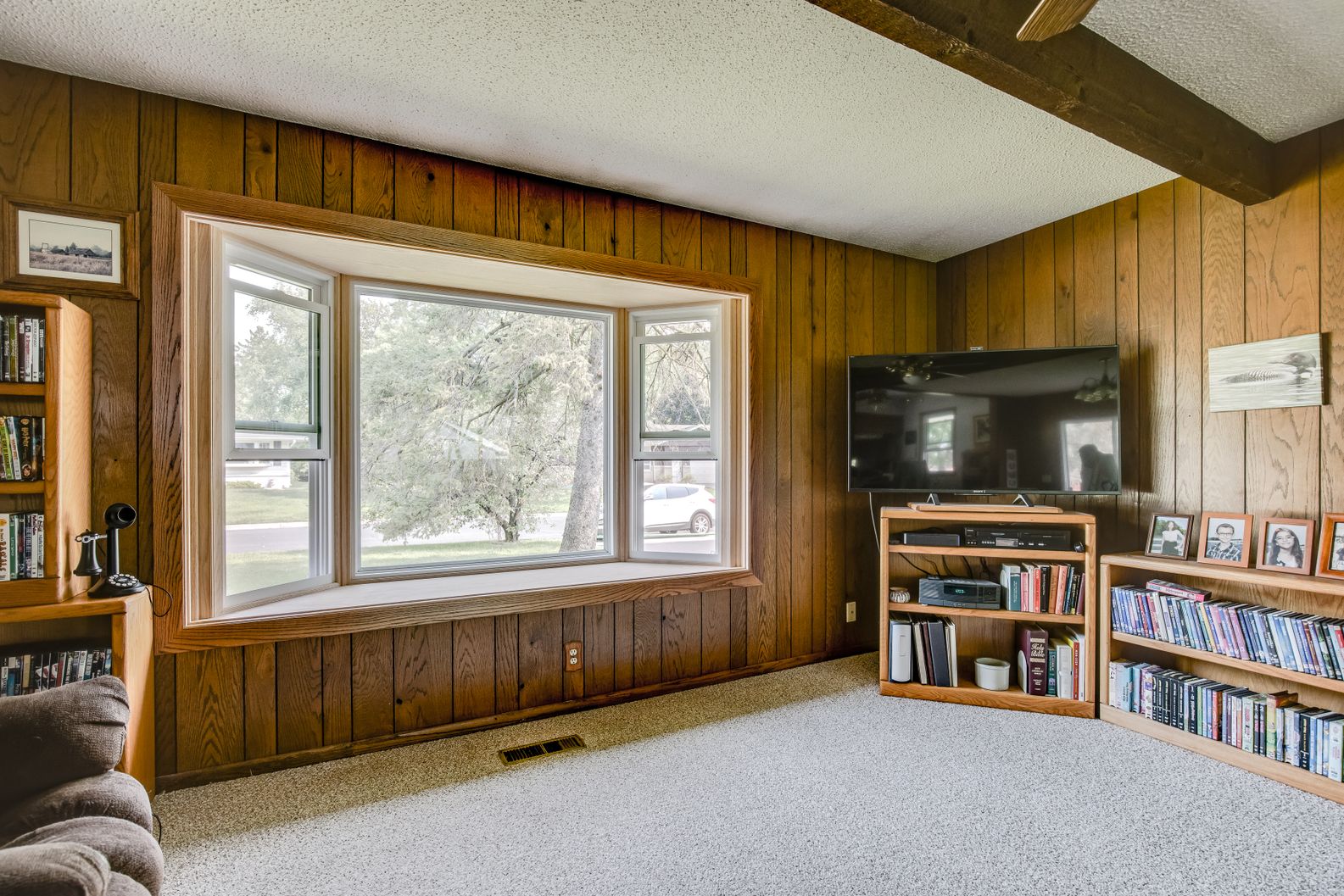 3221-Poe-Rd-AFTER_001 Large living room with new bay window and beige carpeting