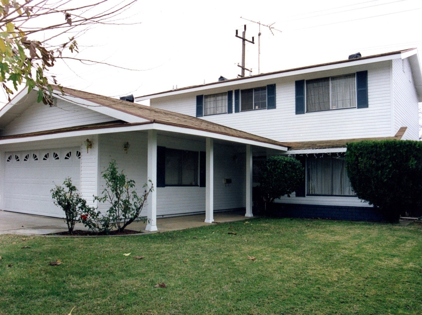 21-A Craftsman-style house with restored windows and new entry door