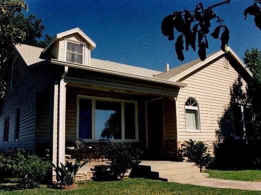 25-A Front view of remodeled ranch home with upgraded siding and doors
