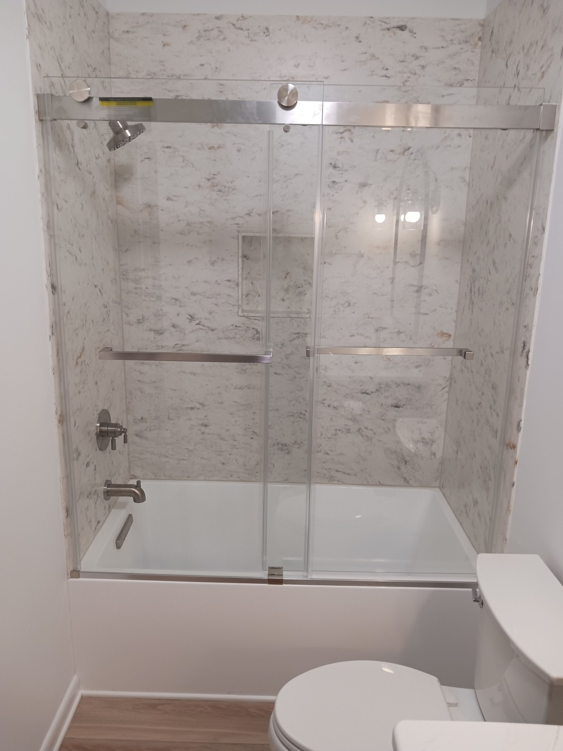 6fd23fc8208a11f0959431bf7cfa507e Frameless glass shower installation with gray tile walls
