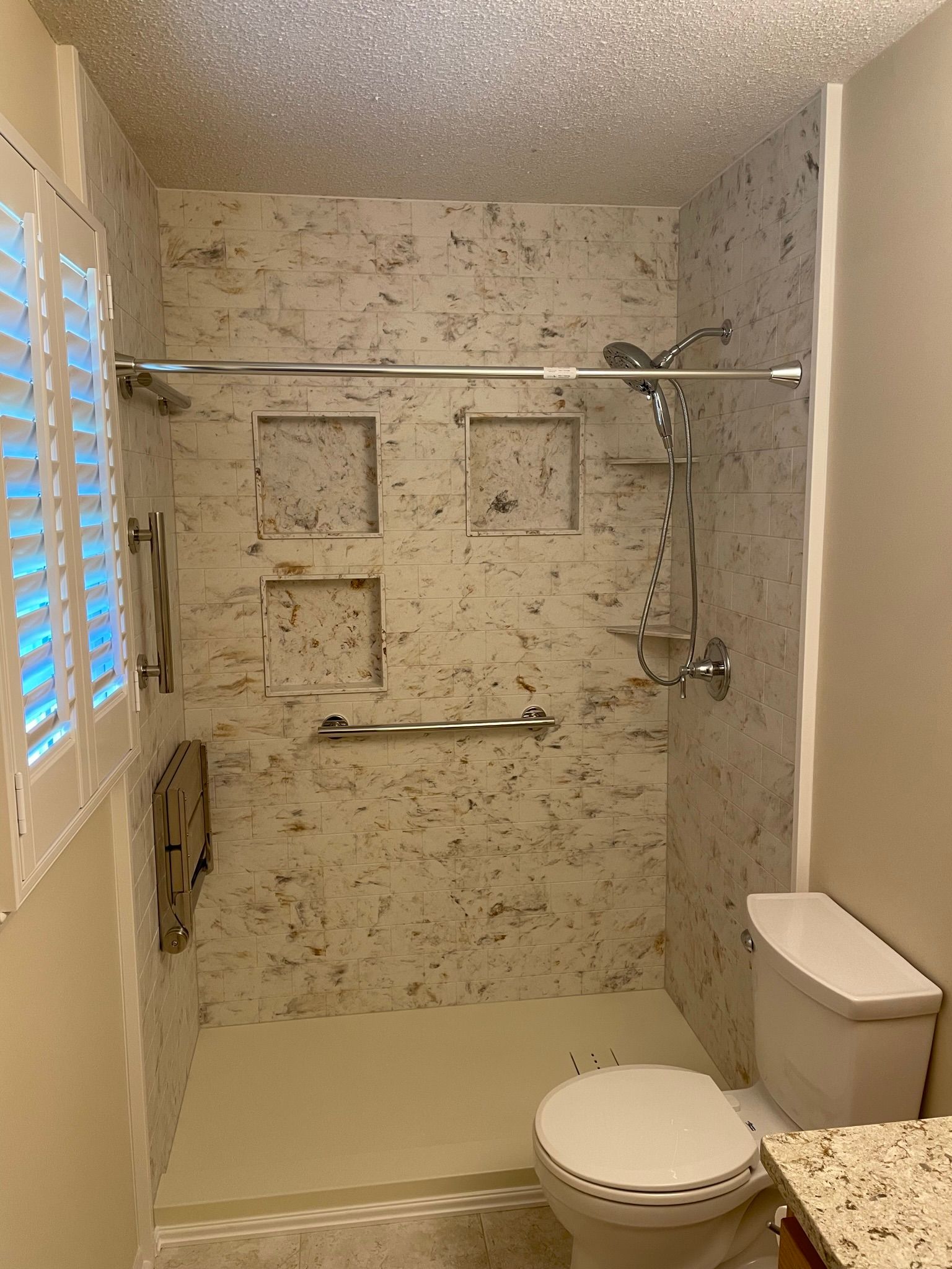 75e2f45c208a11f09edfffeead48a175 Small bathroom remodel featuring beige tile shower and window